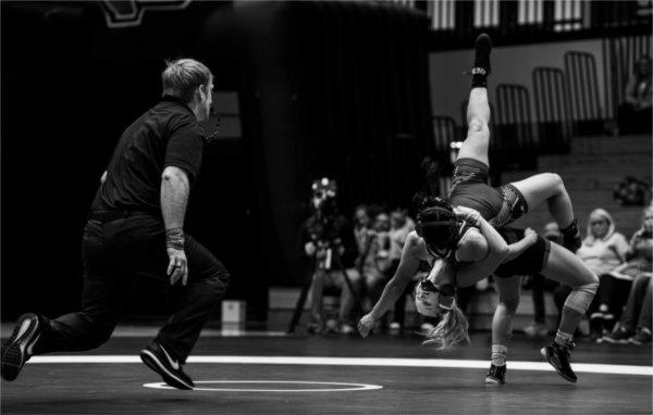   A member of the Women's Wrestling team takes on an opponent. 