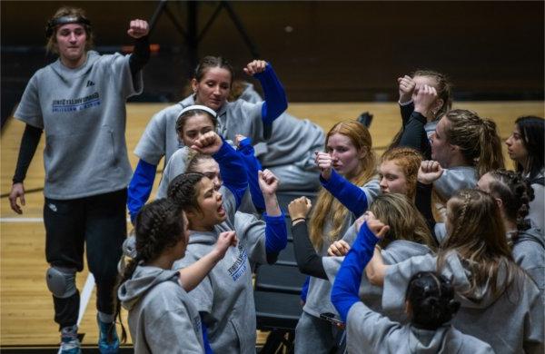 The women's wrestling team congregates to pump each other up in between matches of its inaugural dual meet against Northern Michigan.