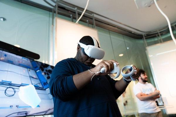 A person wears a virtual reality headset. 