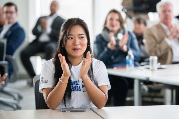 Emily Par claps after the premiere of the National Convening video.