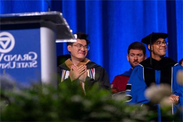 Jowei Yek, student speaker at Saturday morning's ceremony, smiles with gratitude as he is announced.