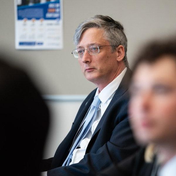 U.S. Department of Education Under Secretary James Kvaal listens to a student