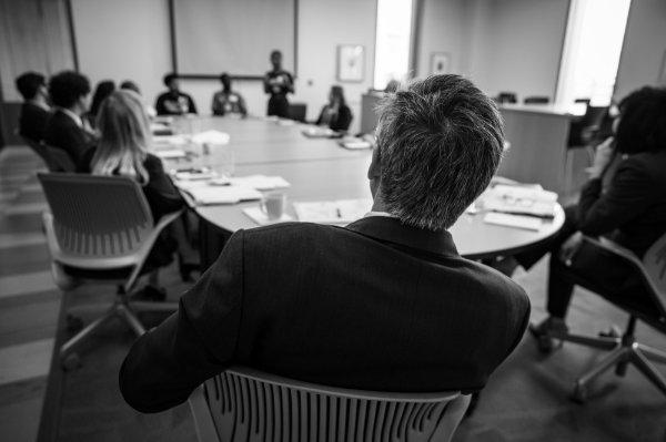 U.S. Department of Education Under Secretary James Kvaal listens to a student