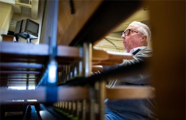  A carillonneur makes a funny face as he practices the carillon. 