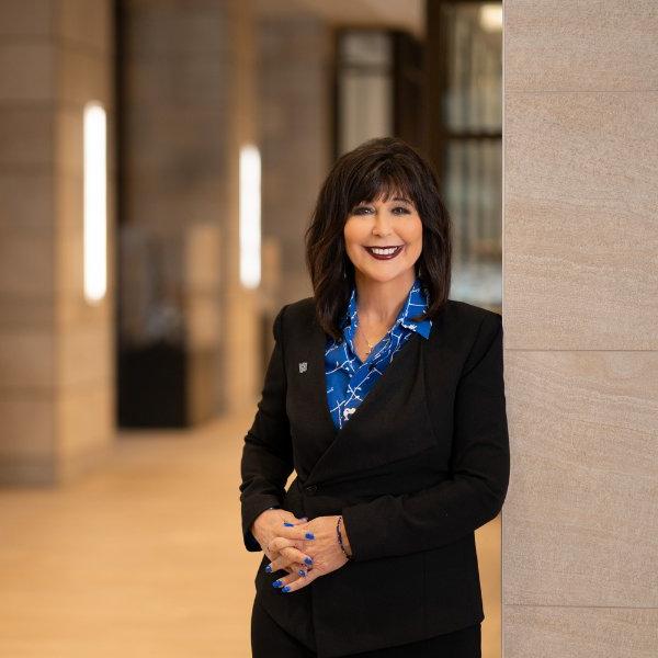 Philomena Mantella smiles while posing for a photo.